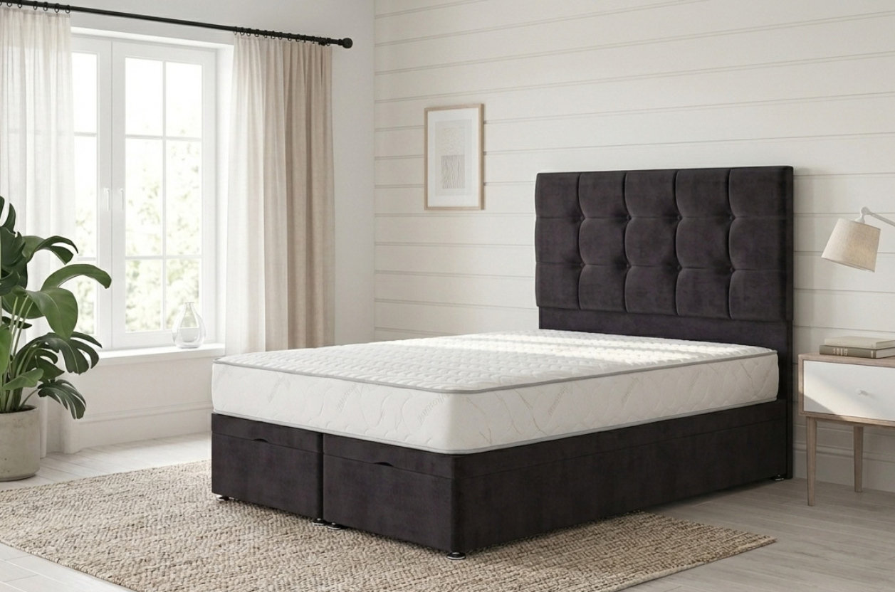 A black ottoman bed with memory foam mattresses and a chesterfield headboard, positioned in a Scandinavian style bedroom.